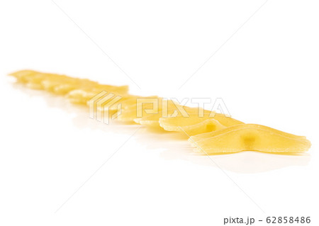Yellow farfalle pasta isolated on white 62858486