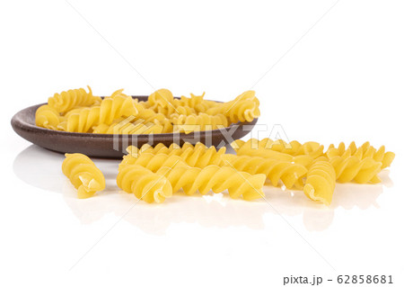 Yellow fusilli pasta isolated on white 62858681
