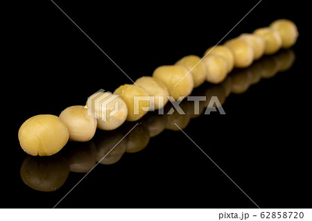 Canned pea isolated on black glass Canned pea isolated on black glass 62858720