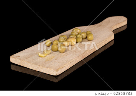 Canned pea isolated on black glass Canned pea isolated on black glass 62858732