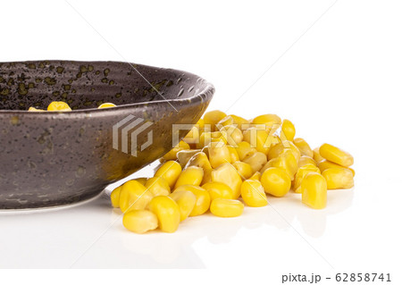 Yellow canned corn isolated on white Yellow canned corn isolated on white 62858741