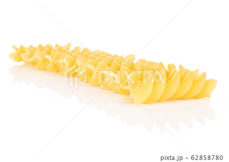 Yellow fusilli pasta isolated on white Yellow fusilli pasta isolated on white 62858780