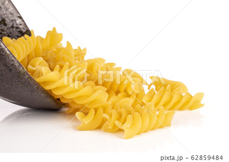 Yellow fusilli pasta isolated on white Yellow fusilli pasta isolated on white 62859484