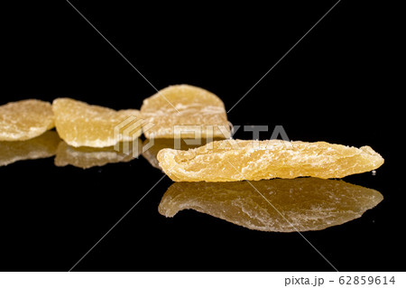 Dried yellow pineapple isolated on black glass 62859614