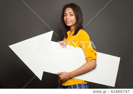 Happy african american woman holding white empty 62860797