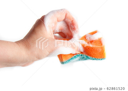 Hand compresses a soapy sponge for washing dishes 62861520