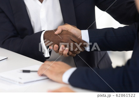 Close up of male handshake after effective negotiation 62861522