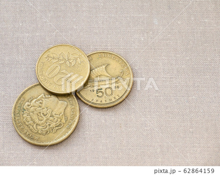 Greek drachma coins on the canvas background Greek drachma coins on the canvas background 62864159