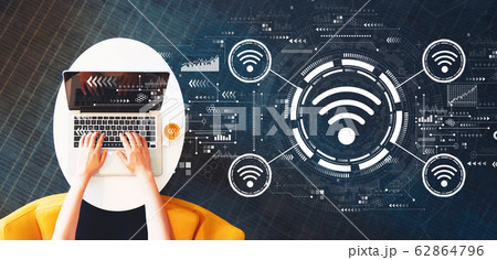 Wifi theme with person using a laptop 62864796