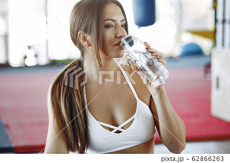 Sports girl training in a morning gym Sports girl training in a morning gym 62866263