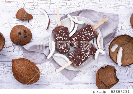 Coconut popsicles in chocolate glaze Coconut popsicles in chocolate glaze 62867251