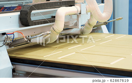 Milling a wooden board. Processing of wood panels Milling a wooden board. Processing of wood panels 62867619