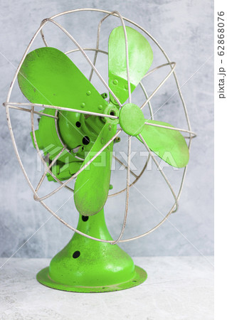 Retro fan of green color as decoration 62868076