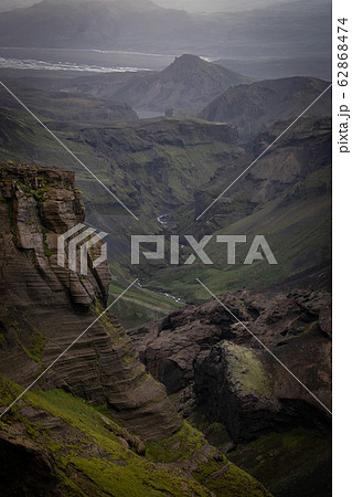Canyon with different colored layers cliffs and hills 62868474