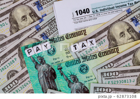 IRS 1040 tax return form with currency US dollar IRS 1040 tax return form with currency US dollar 62873108