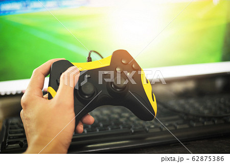 Gamer and guy controller with game pad joystick on Gamer and guy controller with game pad joystick on 62875386