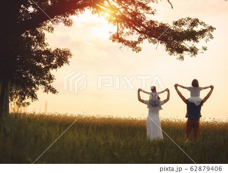 Happy family on summer walk Happy family on summer walk 62879406