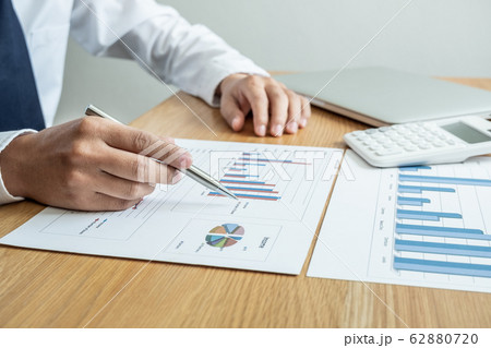 business leader discussing the charts and graphs showing the results, Planning to start new strategy for big success business leader discussing the charts and graphs showing the results, Planning to start new strategy for big success 62880720
