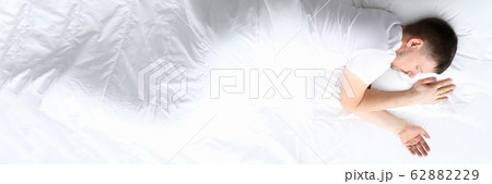 Young caucasian beauty woman sleeping on white bed Young caucasian beauty woman sleeping on white bed 62882229