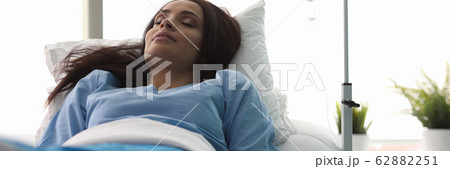 Tired lady lying in hospital ward Tired lady lying in hospital ward 62882251