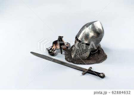 Knight's metal helmet isolated on white background. 62884632
