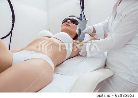 Woman during hair removal using modern laser technology 62885953
