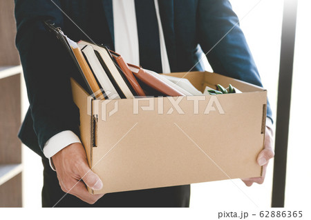 Sad Fired Young Employee businessmen hold boxes 62886365