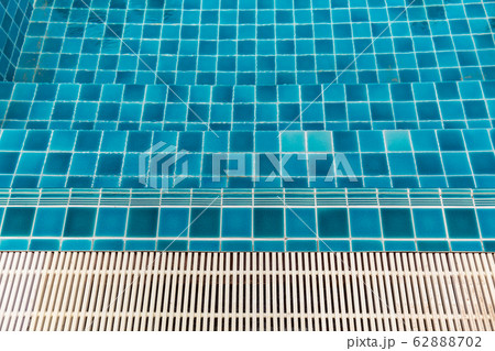 Swimming Pool.swimming pool bottom caustics ripple and flow with waves background.Swimming pool of luxury hotel. 62888702