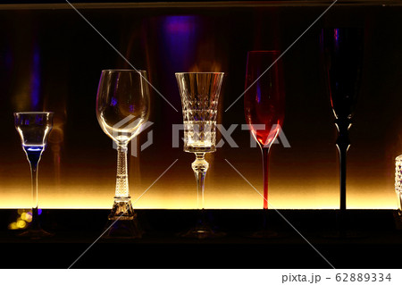 empty bottles and wine glass decorative on backlit 62889334