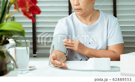 senior woman is detecting blood pressure at home senior woman is detecting blood pressure at home 62889553