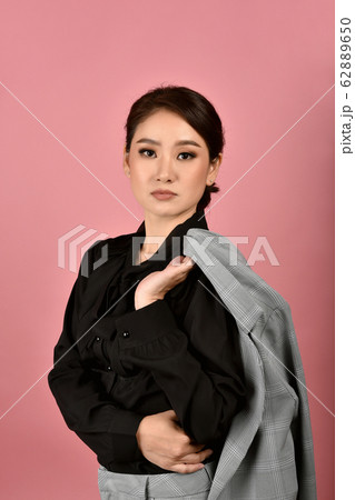 Confident business asian woman isolated in studio shot. 62889650