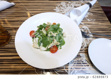 Italian Crab Salad with tomato on white plate 62889873