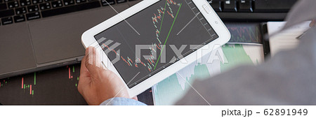 Businessman broker Analyzing finance data graphs 62891949