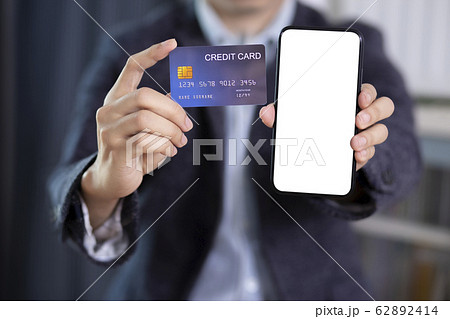 Man hand holding blank screen smartphone with 62892414