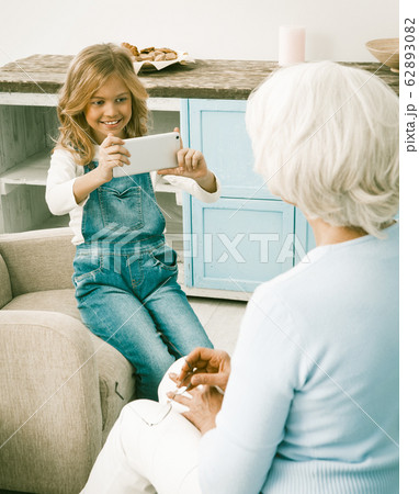 Granddaughter Trying Grandmothers New Phone Granddaughter Trying Grandmothers New Phone 62893082