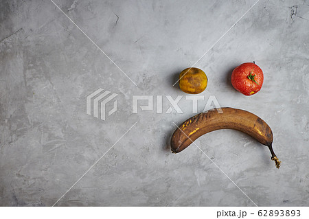 Ugly food. spoiled products lie on a gray concrete background. top view. 62893893