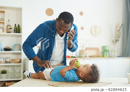 Man Babysitting Son 62894625