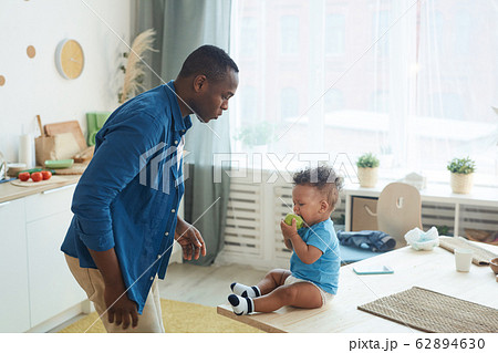 Father Trying to Calm Crying Baby 62894630