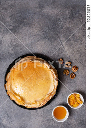 Pancakes with honey, healthy breakfast, brunch, food, morning eating. Copy space for text. Pancakes with honey, healthy breakfast, brunch, food, morning eating. Copy space for text. 62896833