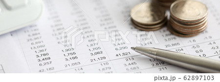 Silver pen lying over financial statistics paper with set of numbers Silver pen lying over financial statistics paper with set of numbers 62897103