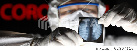 Male doctor wearing protective suit mask and gloves 62897116