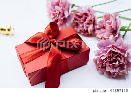 White background with red gift box and peony White background with red gift box and peony 62897156
