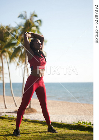 Fit woman stretching back 62897392
