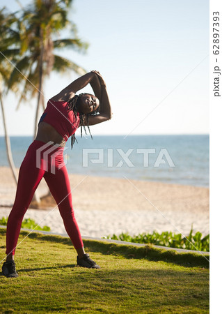 Woman doing side bends 62897393