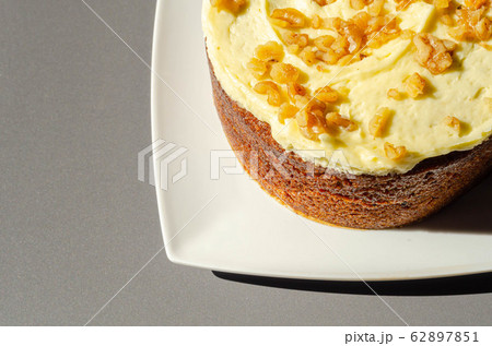 Carrot cake filled and topped with cream cheese Carrot cake filled and topped with cream cheese 62897851