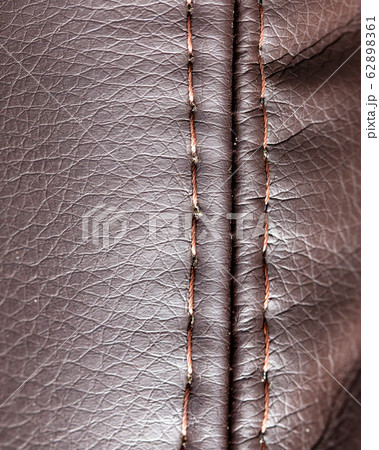 Stitch thread on brown leather material as Stitch thread on brown leather material as 62898361
