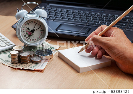 Business male hand use pencil writing on paper 62898425