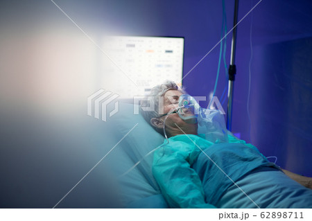 Infected patient in quarantine lying in bed in hospital, coronavirus concept. 62898711