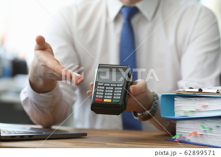 Man holds his hand wireless terminal for payment 62899571