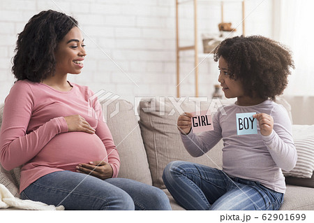 Cute Afro Girl And Her Pregnant Mother Guessing Baby Gender Together Cute Afro Girl And Her Pregnant Mother Guessing Baby Gender Together 62901699